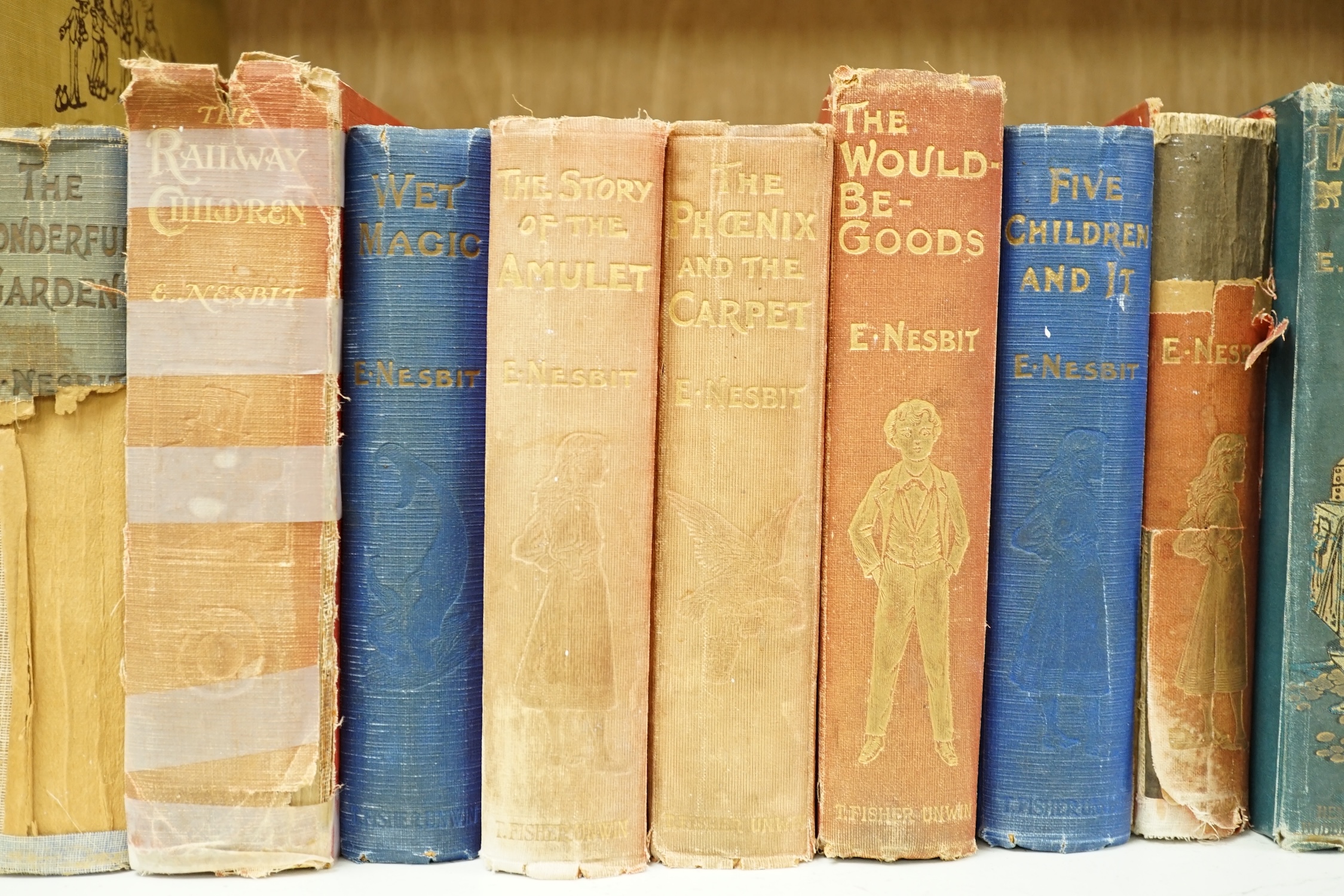 Sixteen novels by E. Nesbit, including The Railway Children, some first editions, and nine other books. Condition - poor